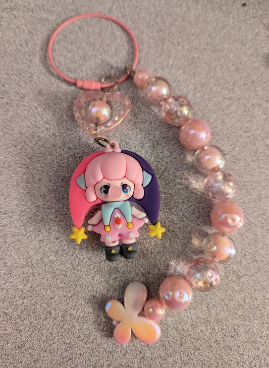 Pink and purple jester keychain with butterflies