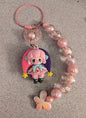 Pink and purple jester keychain with butterflies