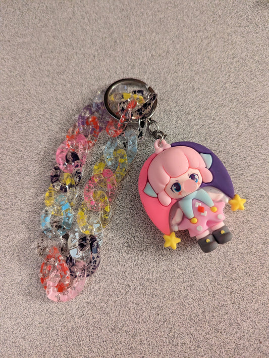 Pink and purple jester with spotted links keychain